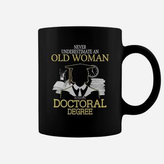 Never Underestimate Old Woman With Doctoral Degree Coffee Mug - Seseable