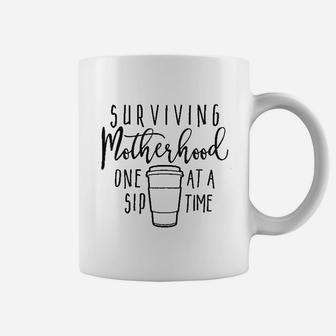 Surviving Motherhood One Sip At A Time Coffee Mug - Seseable