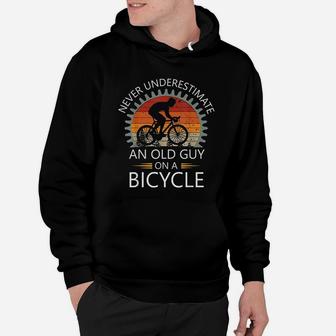 An Old Guy On A Bicycle Cycling Vintage Never Underestimate Hoodie - Seseable
