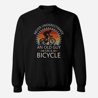 An Old Guy On A Bicycle Cycling Vintage Never Underestimate Sweat Shirt - Seseable