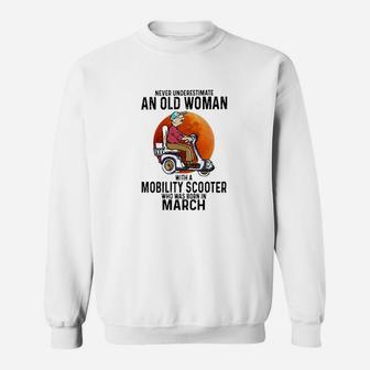 Never Underestimate A Old Woman With A Mobility Scooter Who Was Born In March Sweatshirt - Seseable