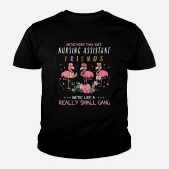 We Are More Than Just Nursing Assistant Friends We Are Like A Really Small Gang Flamingo Nursing Job Kid T-Shirt - Seseable
