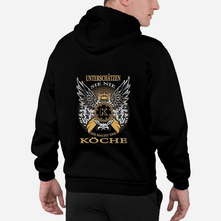 Schwarzes Hoodie mit goldenem Köche-Emblem, Flügeln & Spruch