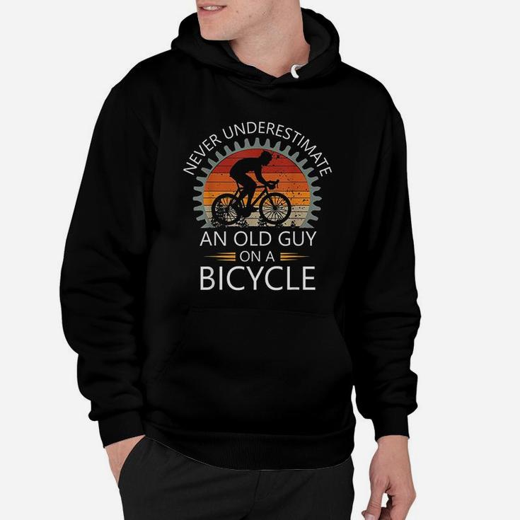 An Old Guy On A Bicycle Cycling Vintage Never Underestimate Hoodie