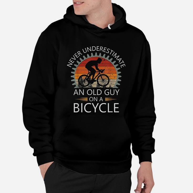 An Old Guy On A Bicycle Cycling Vintage Never Underestimate Hoodie