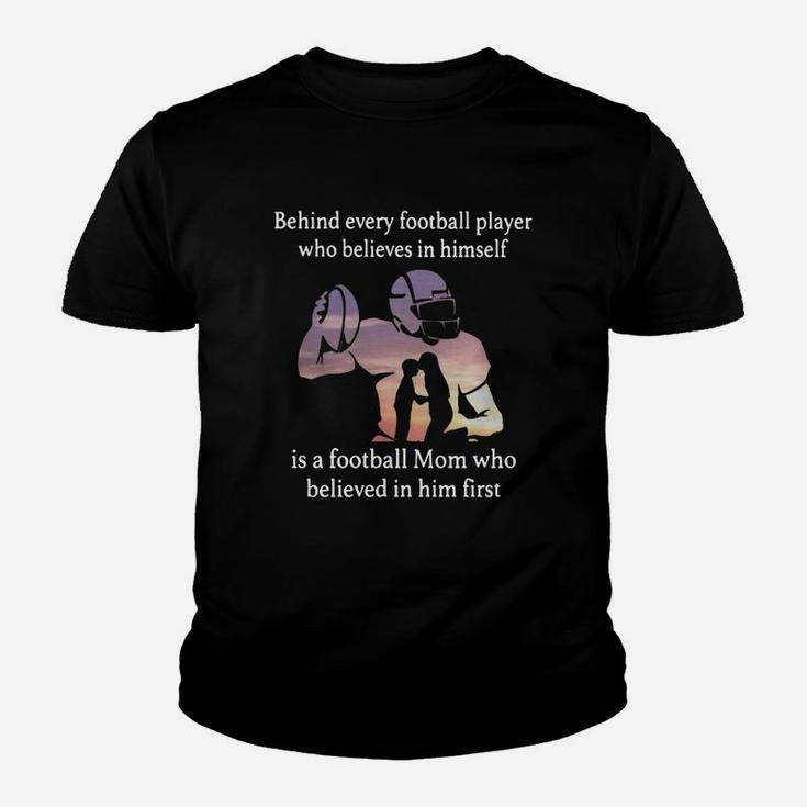 Behind Every Football Player Who Believes In Himself Is A Football Mom Who Believed In Him First Kid T-Shirt